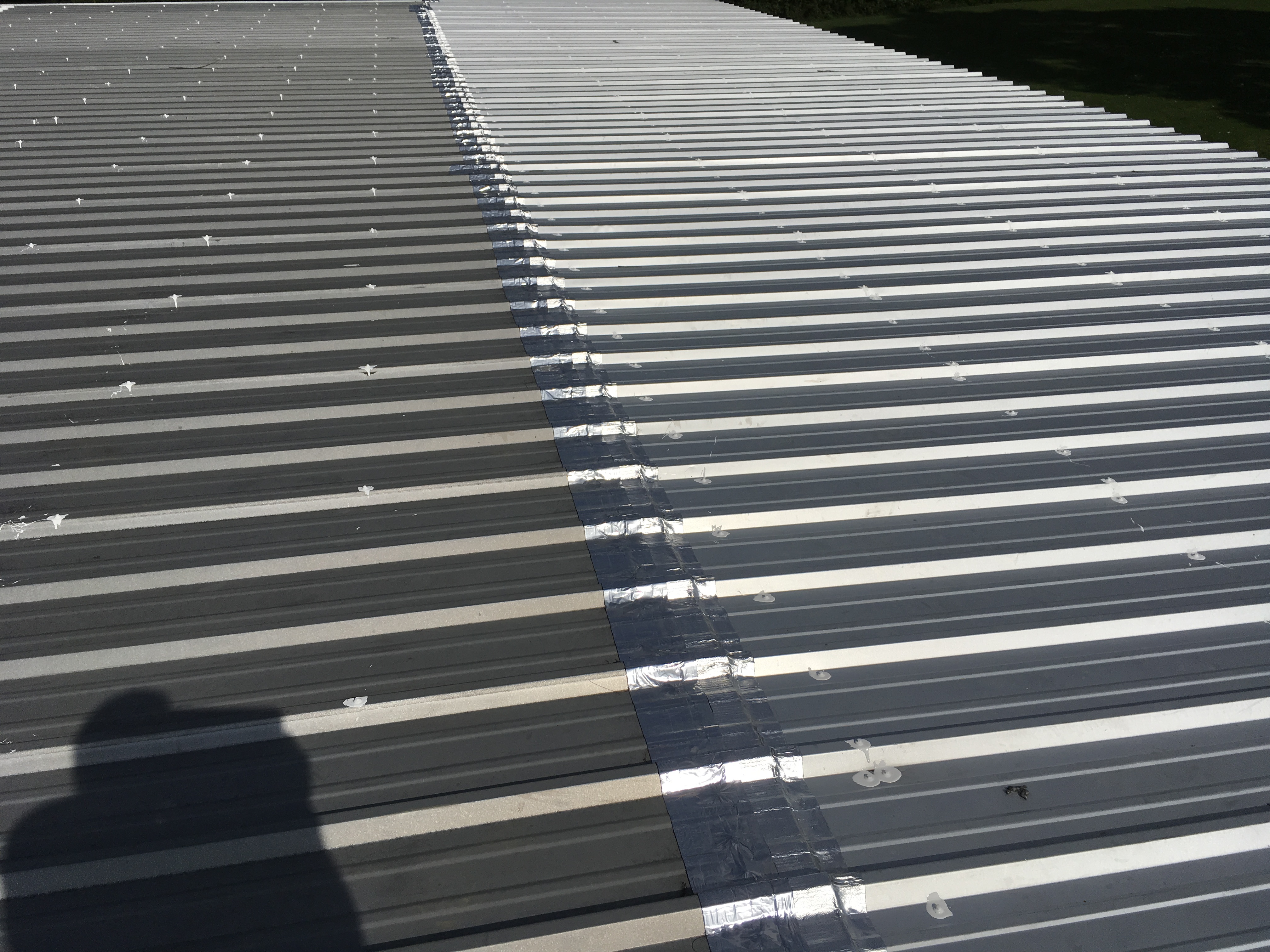 Customer photo: a second seam with aluminum-faced tape. These are different seams, not before-and-after photos.
