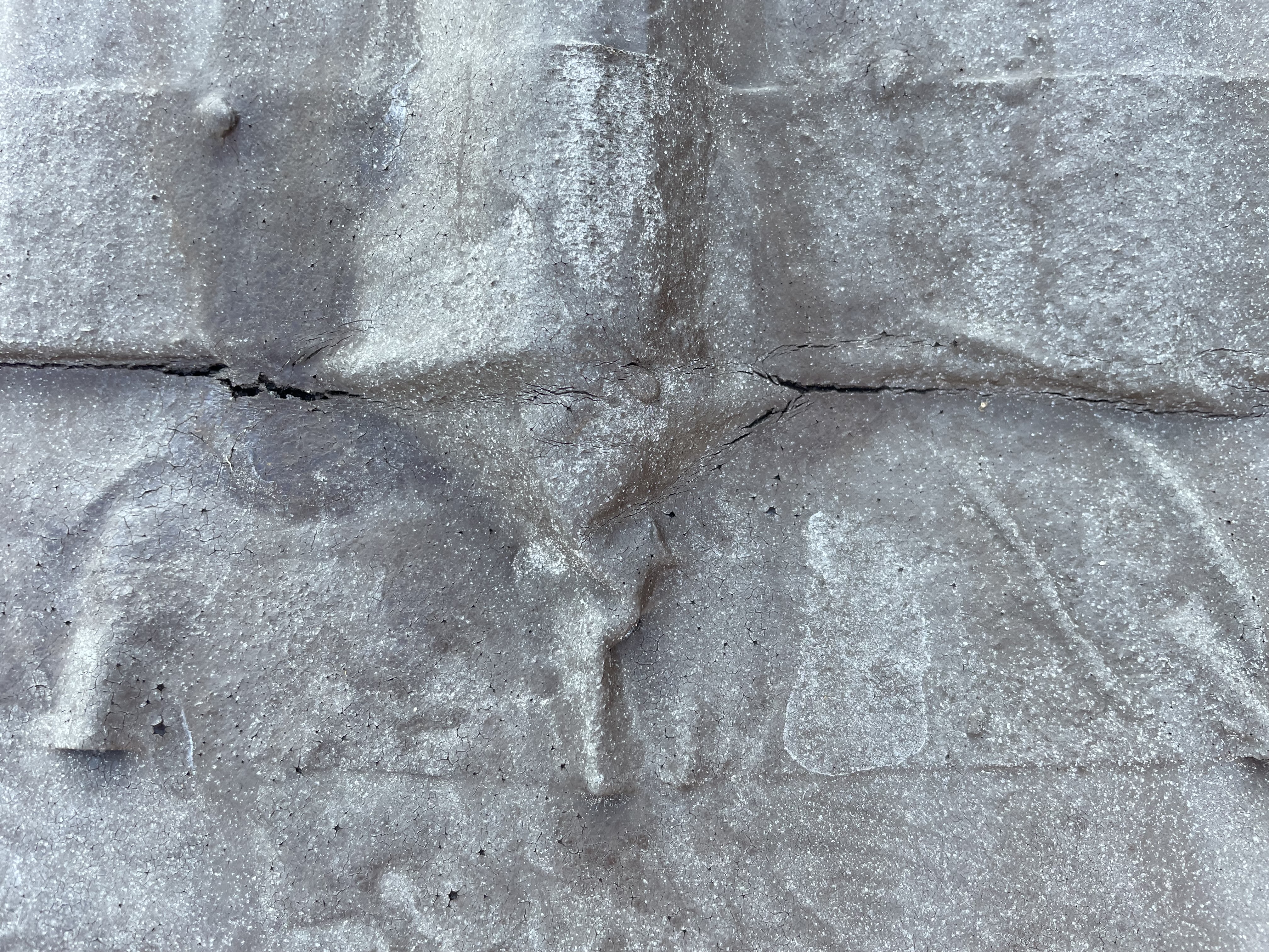 Customer photo showing cracking along the repaired metal-roof transition.