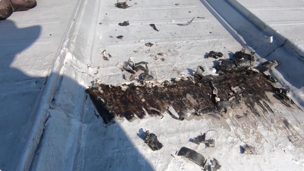 Removing Silver Coating from a metal roof seam.