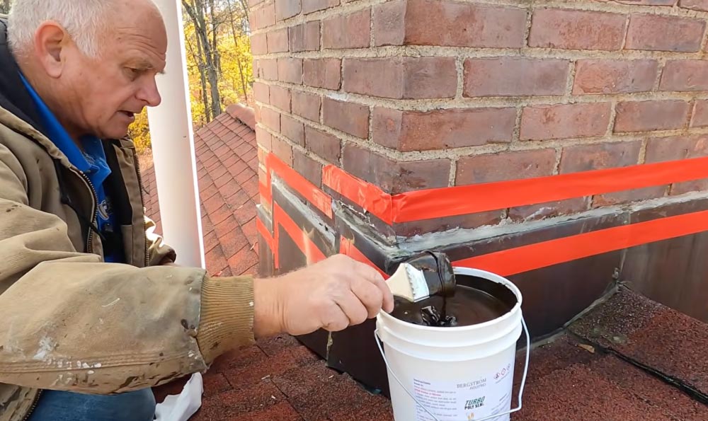 Applying Turbo Poly Seal over the flashing and brick yp bridge the gap