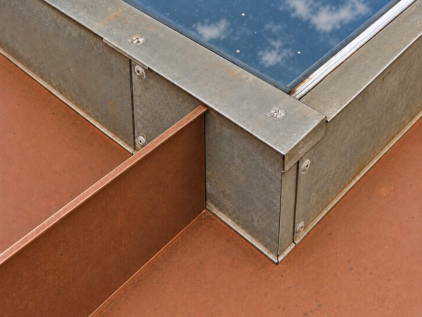 Preparation illustration: old sealant removed, with the roof rib still meeting the skylight curb