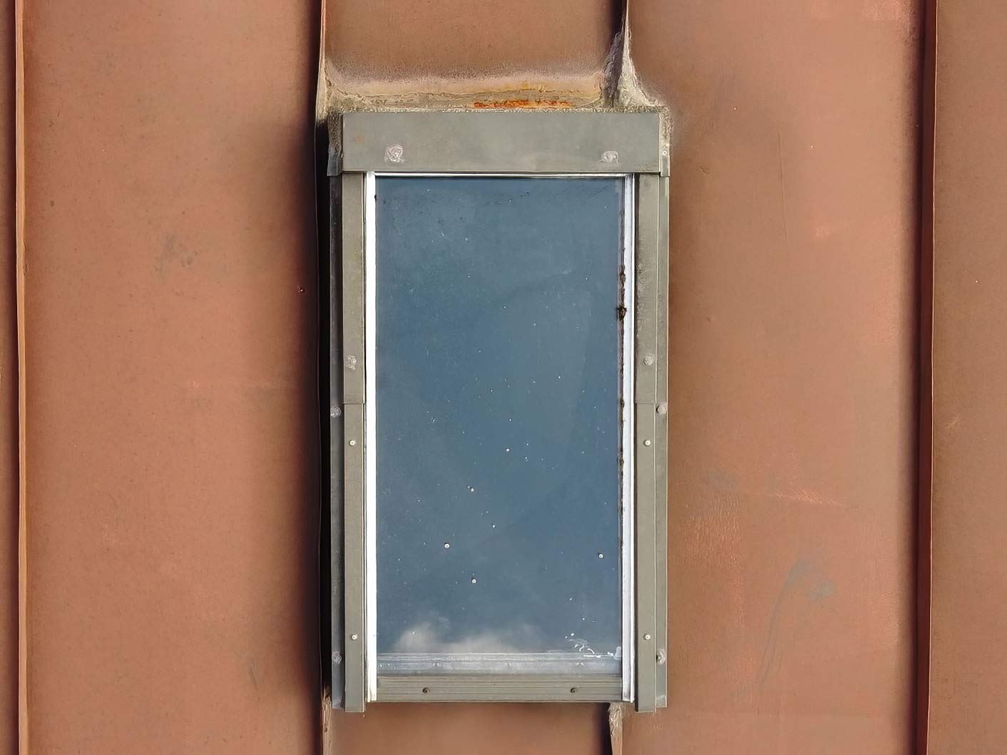 Customer's original photo: skylight on a metal roof in the Italian Alps